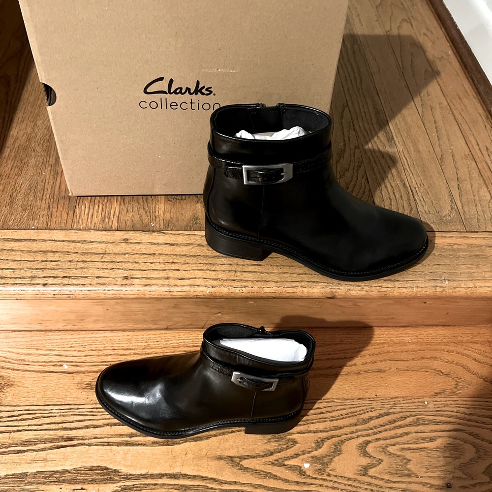 Clarks boots size 10.  Never even left the box.  Brand new black leather boots
